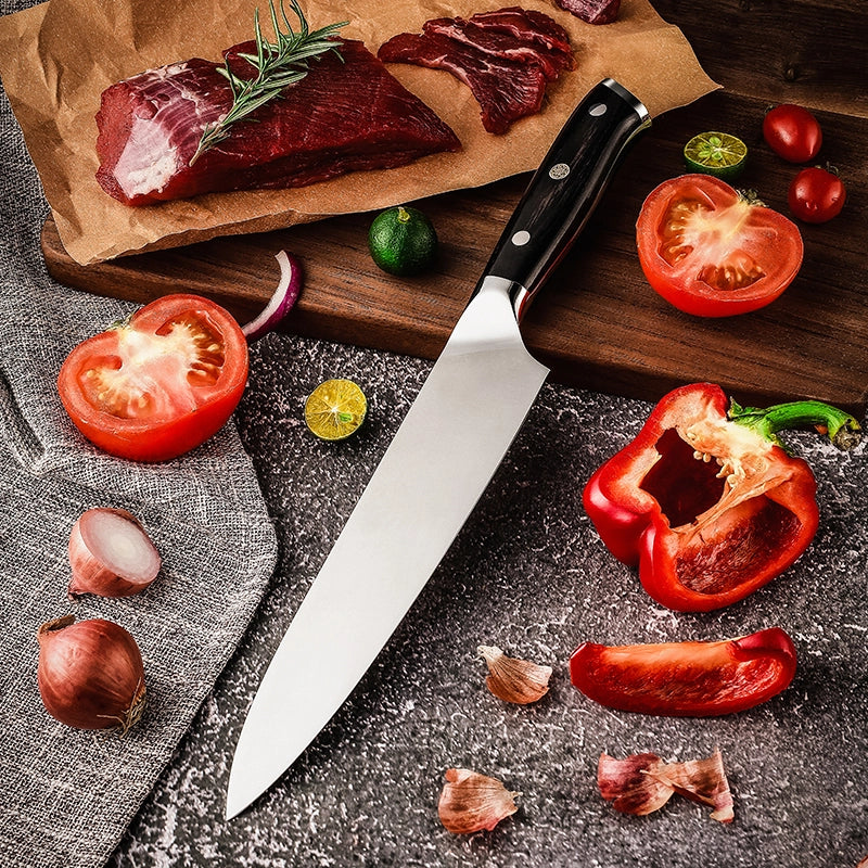 Wooden cutting board with raw meat, knife, and vegetables on a dark surface